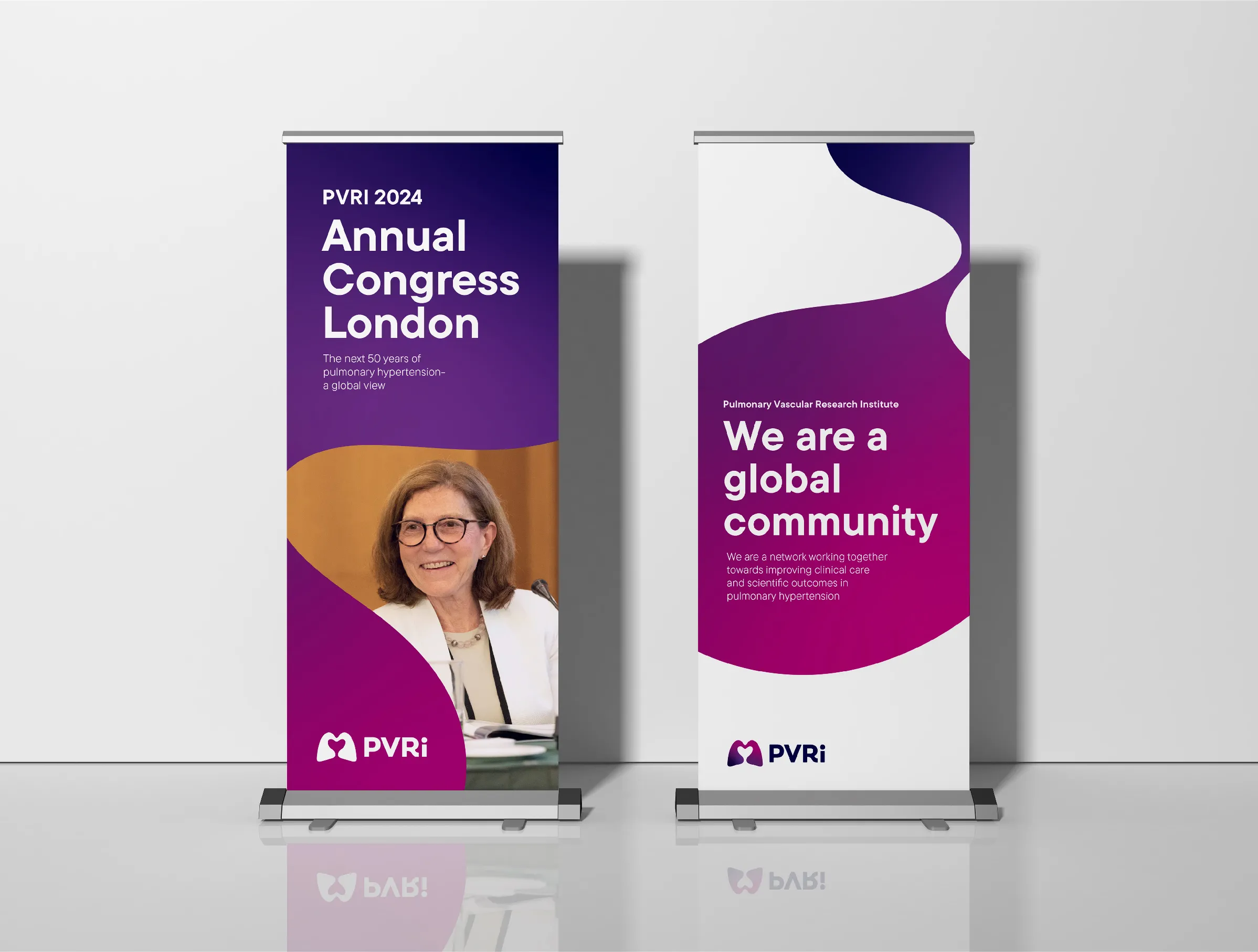 Pair of PVRI branded banner stands for an event